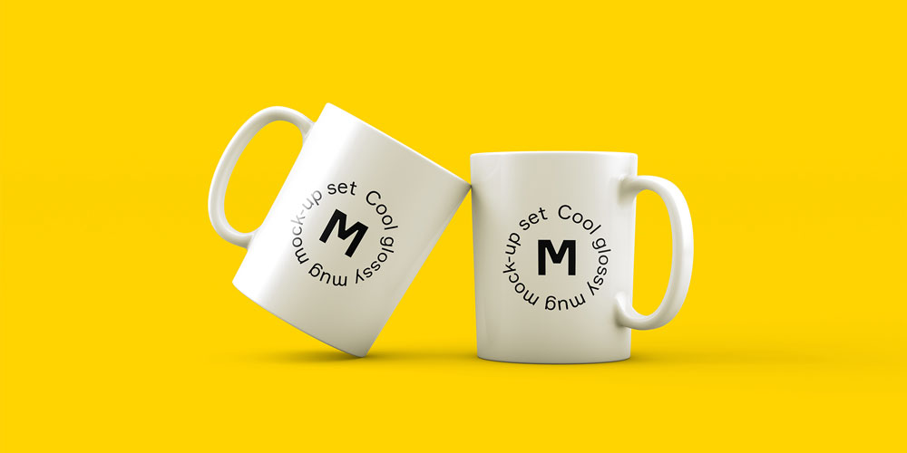 Two white ceramic coffee mugs with a 'Cool glossy mug mock-up set' design and a black 'M' logo, angled on a vibrant yellow background, perfect for branding.